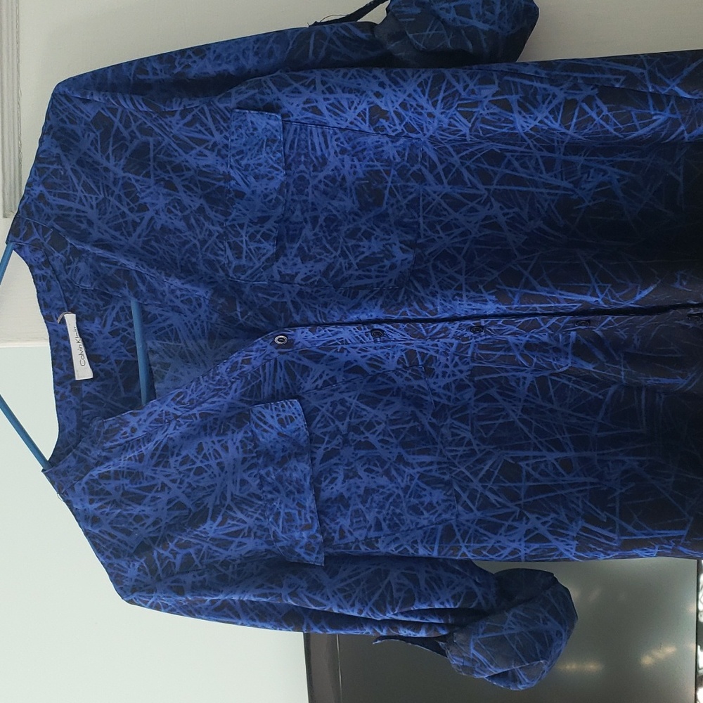 A Calvin Klein blue and black shirt.